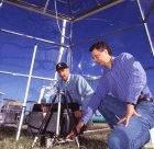 The researchers measure photosynthesis in a chamber