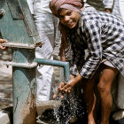 Indian boy at water pump
