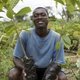 Ivorian cocoa farmer with plants