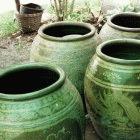 Mosquitoes that spread malaria or dengue fever can breed in water jars like these