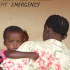 Mother signing baby into hospital in Kenya
