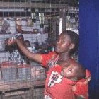 Mother buying malaria drugs for her child