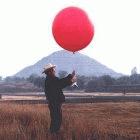 A pollution researcher releases a balloon equipped with temperature sensors near Mexico City.