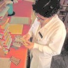 A nurse prepares TB drugs in Peru