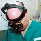 A doctor using an ophthalmoscope