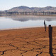 Cracked earth at edge of lake