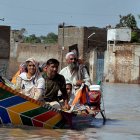 Family escaping floods in Pakistan