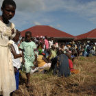 Ugandan patients waiting outside clinic Ugandan patients waiting outside clinic