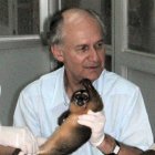 Man holding a small monkey