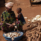 Woman peeling cassava
