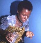 A pregnant woman takes her antimalarial drug in Kenya