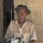 Man listening to radio in Lubumbashi, DR Congo