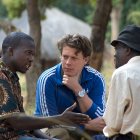 Scientists interacting with farms in the field