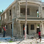 Damaged building in Haiti being surveyed