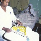 nurse administering tb drugs