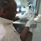 Ugandan scientist at JCRC TB lab