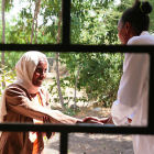 Woman meeting a health worker