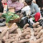 Selling yams in Kumasi market